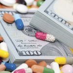 pills and stacks of money