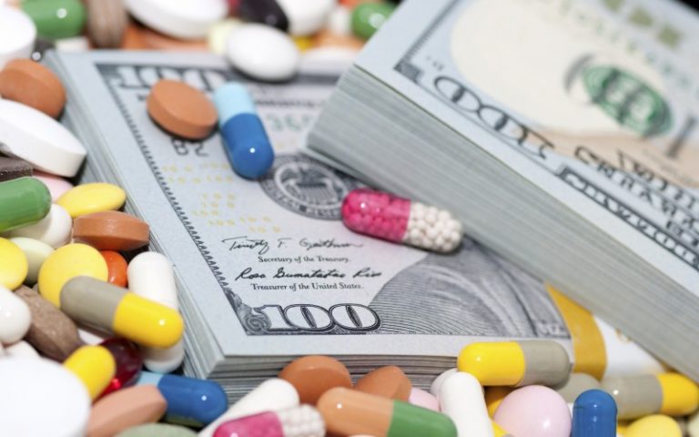 pills and stacks of money